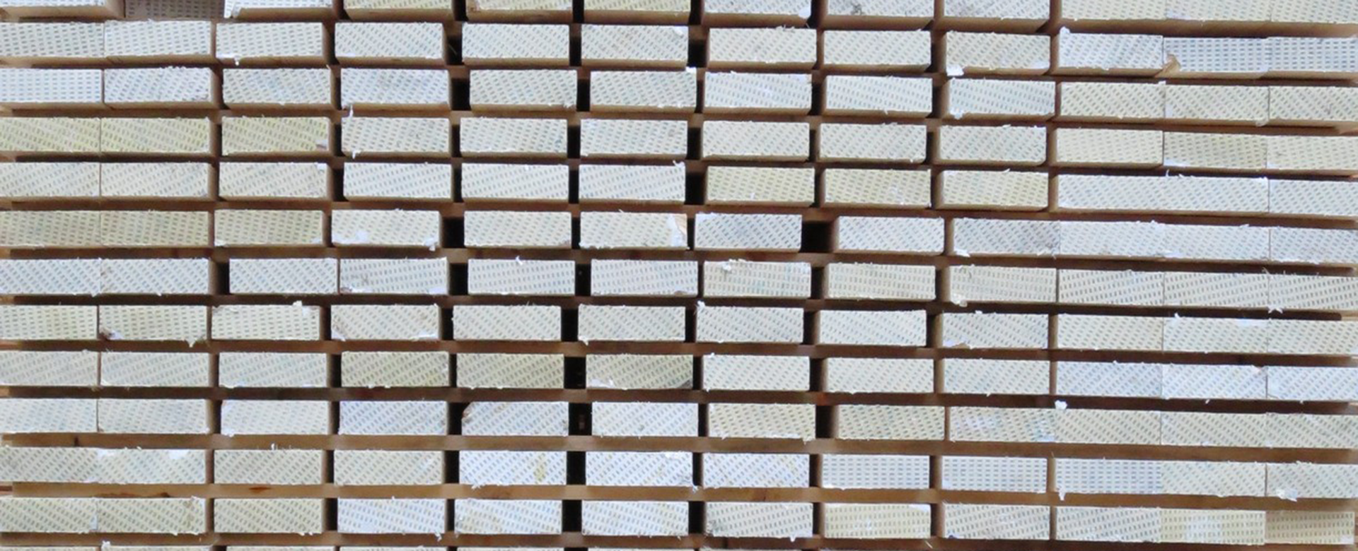 Close-up of stacked sawn timber.